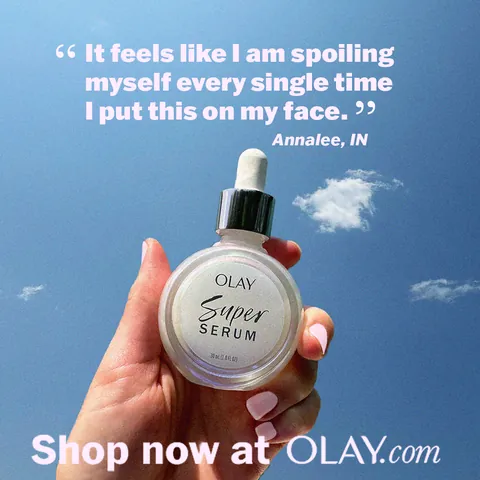 Olay Super Serum testimonial ad, hand holding the serum against blue sky
