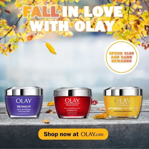 Fall in Love with Olay ad with three Olay jars in autumn leaves